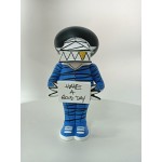 Vinyl art toy of a man in blue clothes holding a sign Vinyl art toy of a man in blue clothes holding a sign