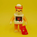 a sofubi yellow cat a sofubi yellow cat