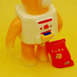 a sofubi yellow cat a sofubi yellow cat